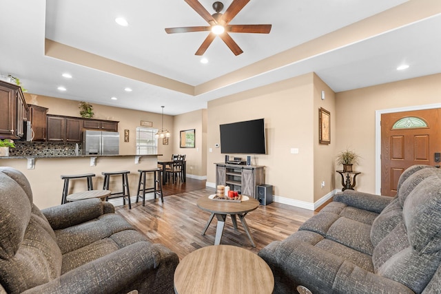122 Thunder Ridge Ct, Branson, MO 65616 - living area featuring ceiling fan, recessed lighting, light wood-style flooring, baseboards, and a raised ceiling