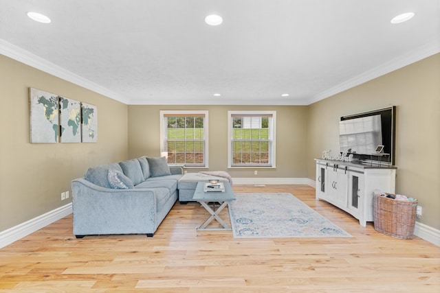 living area with crown molding, recessed lighting, baseboards, and light wood-style flooring