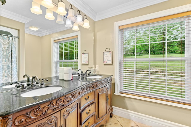 full bathroom with healthy amount of natural light, tile patterned floors, crown molding, baseboards, and double vanity