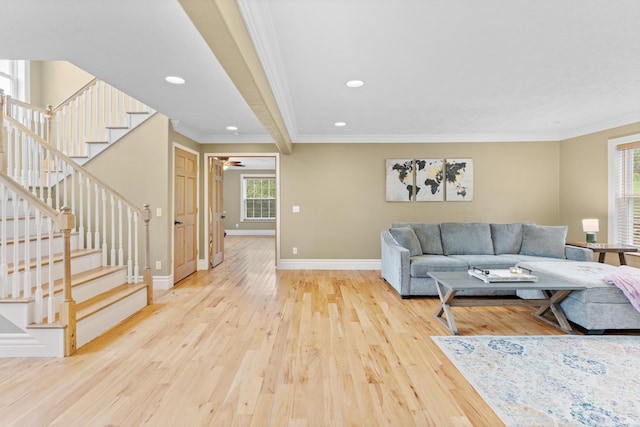 living room with light wood-style flooring, baseboards, stairs, recessed lighting, and ornamental molding