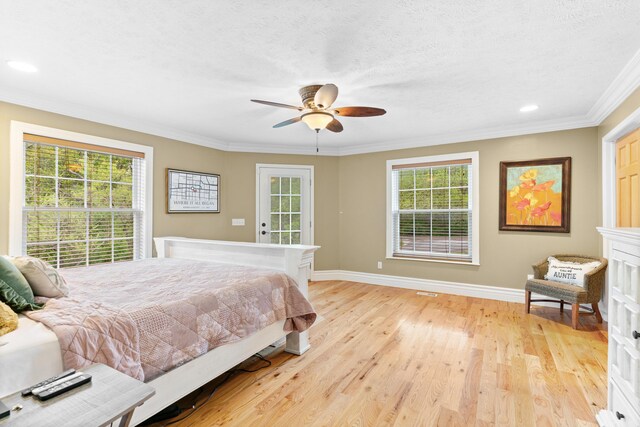bedroom with baseboards, ornamental molding, light wood-style floors, recessed lighting, and a textured ceiling