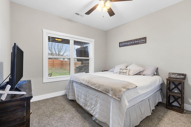 bedroom with carpet flooring, baseboards, and a ceiling fan