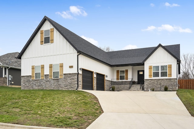 modern farmhouse style home with stone siding, board and batten siding, driveway, and roof with shingles