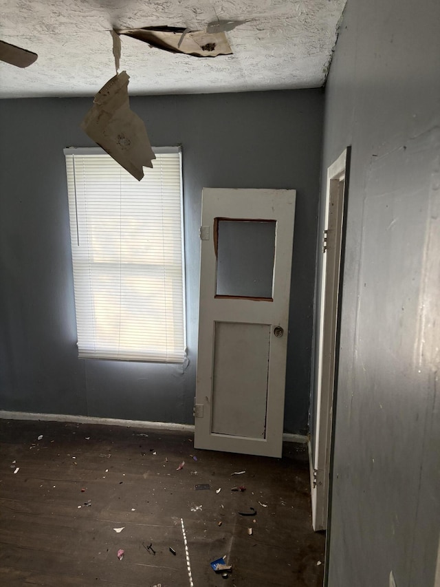 spare room with a textured ceiling