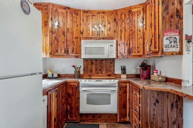 167 Motel Ln, Cape Fair, MO 65624 - kitchen with white appliances and brown cabinetry