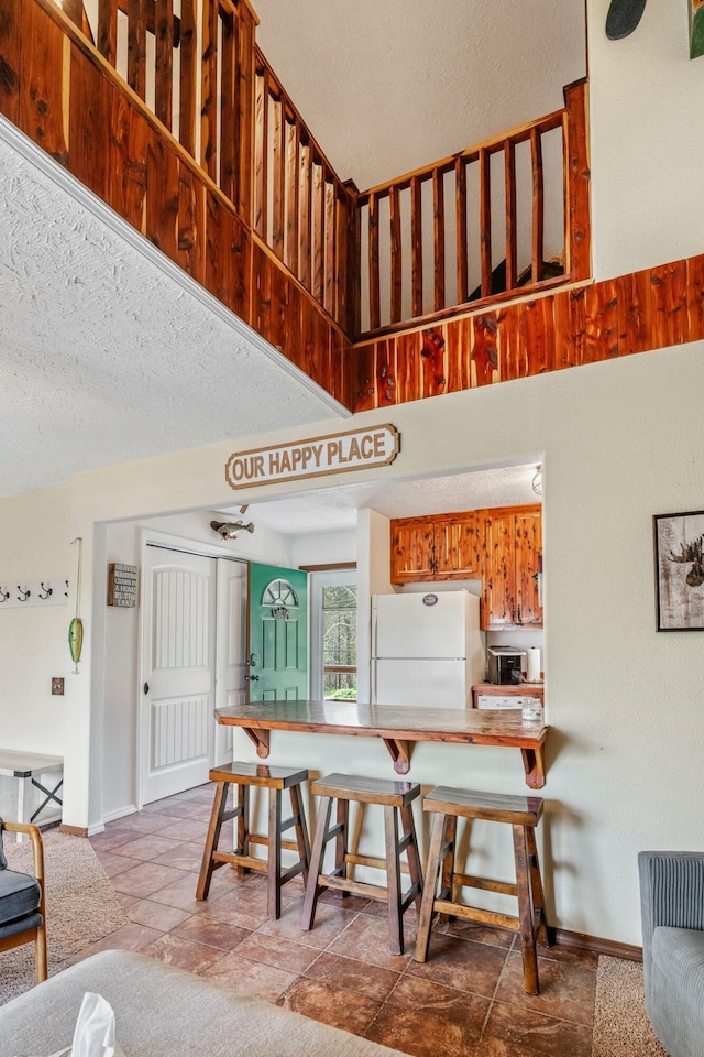 167 Motel Ln, Cape Fair, MO 65624 - dining room featuring baseboards and a textured ceiling