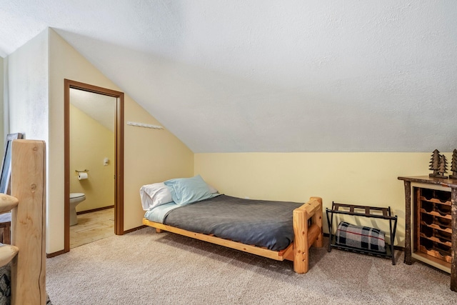167 Motel Ln, Cape Fair, MO 65624 - bedroom featuring carpet flooring, vaulted ceiling, a textured ceiling, ensuite bathroom, and baseboards