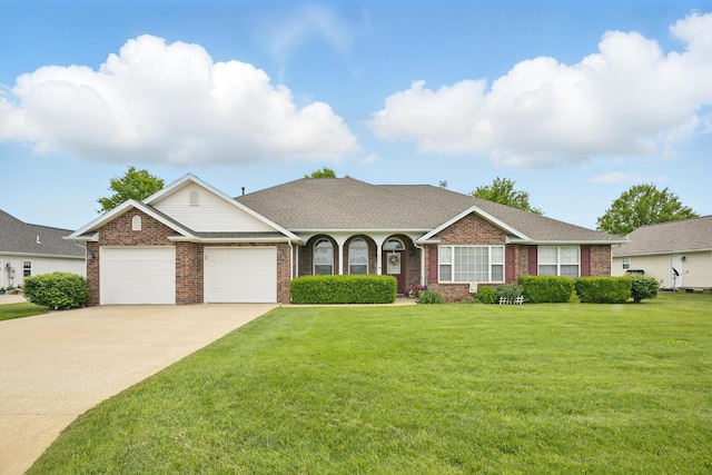 1375 Hale Mcginty Dr, Neosho, MO 64850 - view of front of property featuring an attached garage, brick siding, and concrete driveway