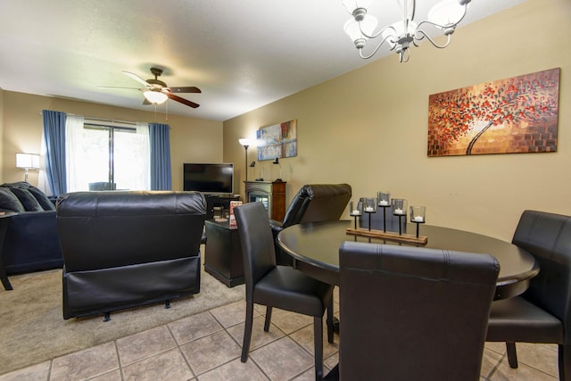 186 Bunker Ridge Dr Unit 2, Branson, MO 65616 - dining room with a chandelier, light tile patterned floors, and ceiling fan