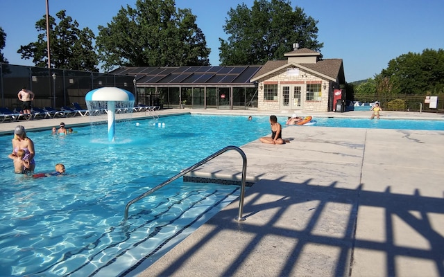 186 Bunker Ridge Dr Unit 2, Branson, MO 65616 - community pool with fence and a patio area