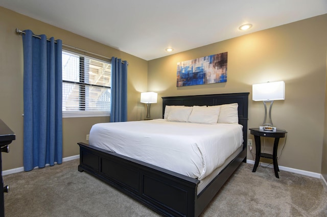 186 Bunker Ridge Dr Unit 2, Branson, MO 65616 - bedroom with light colored carpet, baseboards, and recessed lighting