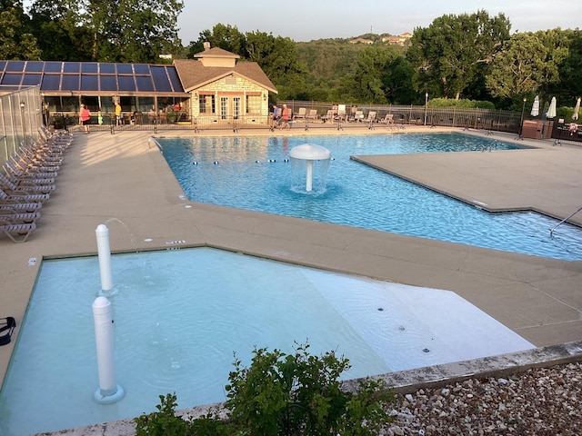 186 Bunker Ridge Dr Unit 2, Branson, MO 65616 - community pool featuring a patio and fence