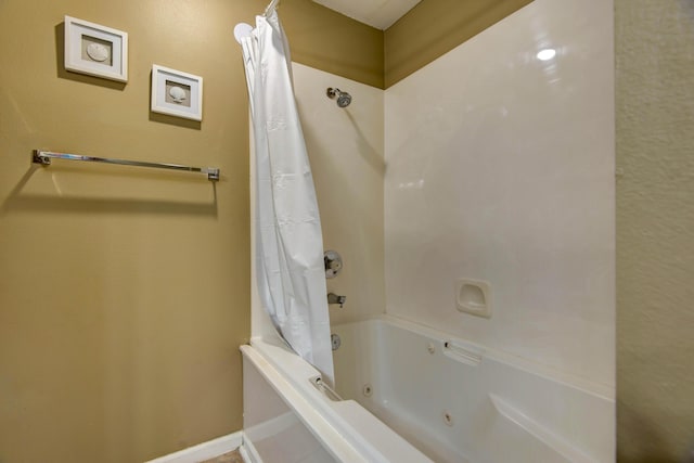 186 Bunker Ridge Dr Unit 2, Branson, MO 65616 - full bath featuring a combined bath / shower with jetted tub and baseboards