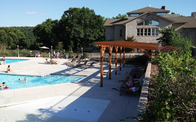 186 Bunker Ridge Dr Unit 2, Branson, MO 65616 - community pool with a patio and fence