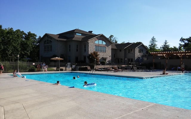 186 Bunker Ridge Dr Unit 2, Branson, MO 65616 - community pool featuring a pergola, fence, and a patio