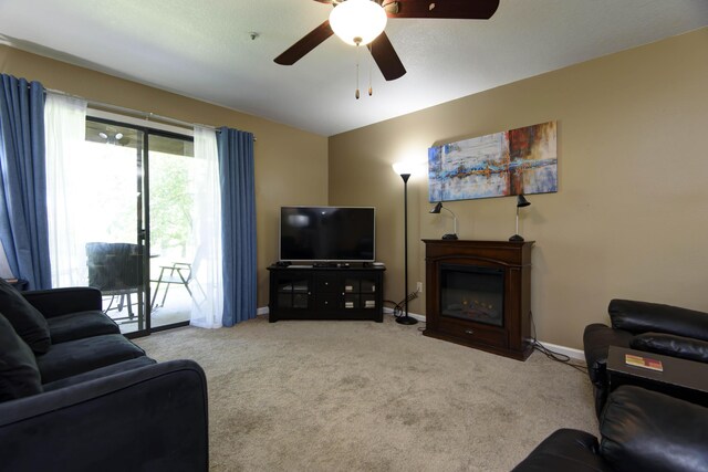 186 Bunker Ridge Dr Unit 2, Branson, MO 65616 - carpeted living area with ceiling fan and baseboards