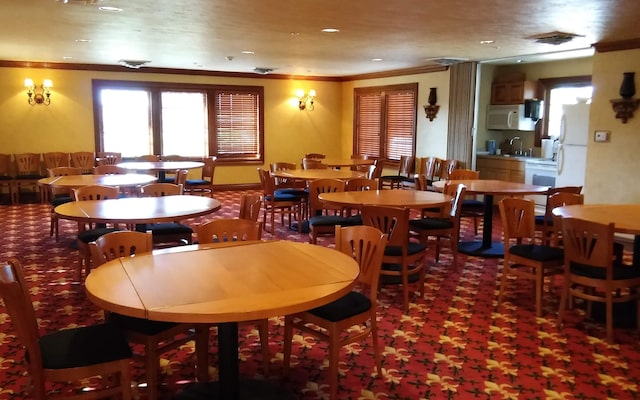186 Bunker Ridge Dr Unit 2, Branson, MO 65616 - dining room with ornamental molding and recessed lighting