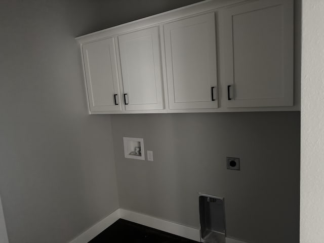 5955 S Farm Rd 163 205A, Springfield, MO 65810 - laundry room with electric dryer hookup, washer hookup, baseboards, and cabinet space