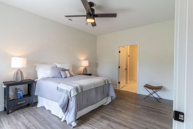 5955 S Farm Rd 163 205A, Springfield, MO 65810 - bedroom featuring wood finished floors, baseboards, and ceiling fan