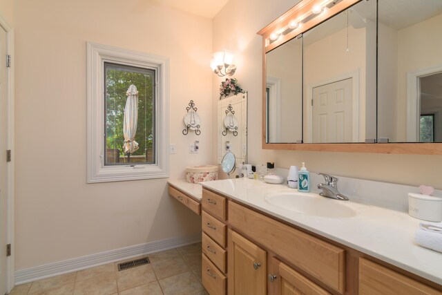 62 Turtledove Ln, Lampe, MO 65681 - bathroom featuring vanity, baseboards, and tile patterned flooring