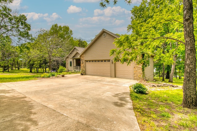 62 Turtledove Ln, Lampe, MO 65681 - view of front of house with concrete driveway and a garage