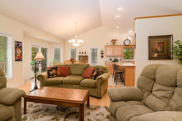 62 Turtledove Ln, Lampe, MO 65681 - living area with a chandelier, vaulted ceiling, light wood-style flooring, and healthy amount of natural light