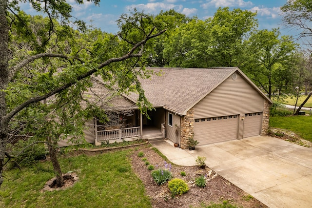 62 Turtledove Ln, Lampe, MO 65681 - view of front of property featuring covered porch, driveway, a garage, a shingled roof, and a front lawn
