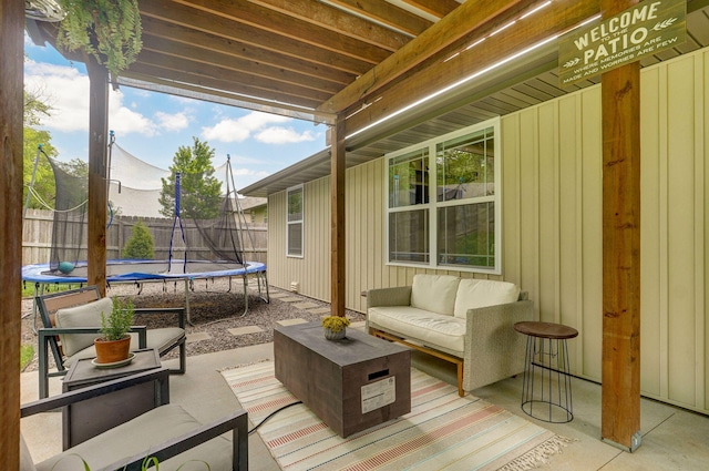 sunroom with an outdoor living space and healthy amount of natural light
