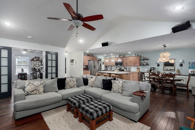 living area with ceiling fan, dark wood-type flooring, recessed lighting, and high vaulted ceiling