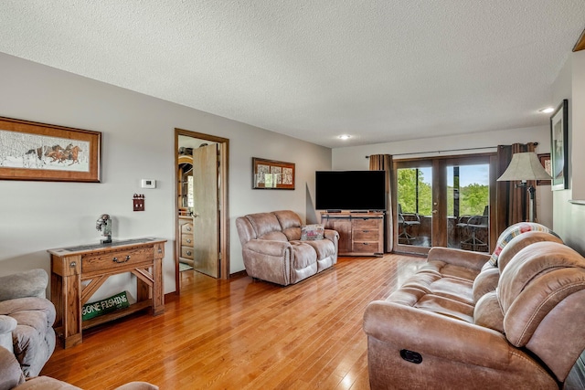 4949 S 196th Rd, Halfway, MO 65663 - living area featuring a textured ceiling and light wood-style flooring