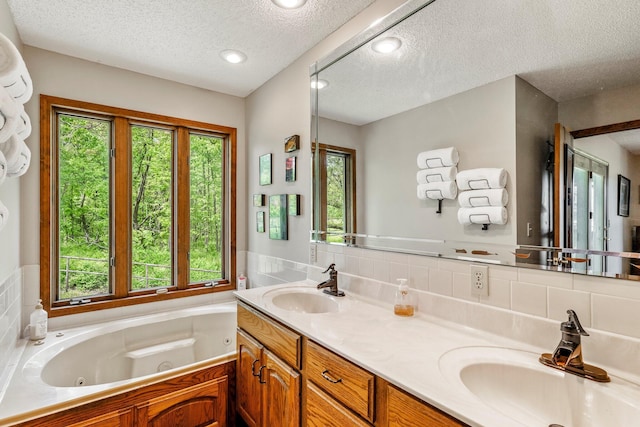 4949 S 196th Rd, Halfway, MO 65663 - bathroom with a textured ceiling, healthy amount of natural light, a tub with jets, tile walls, and double vanity