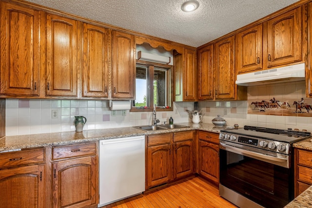 4949 S 196th Rd, Halfway, MO 65663 - kitchen featuring stainless steel electric range, dishwasher, under cabinet range hood, a sink, and brown cabinetry