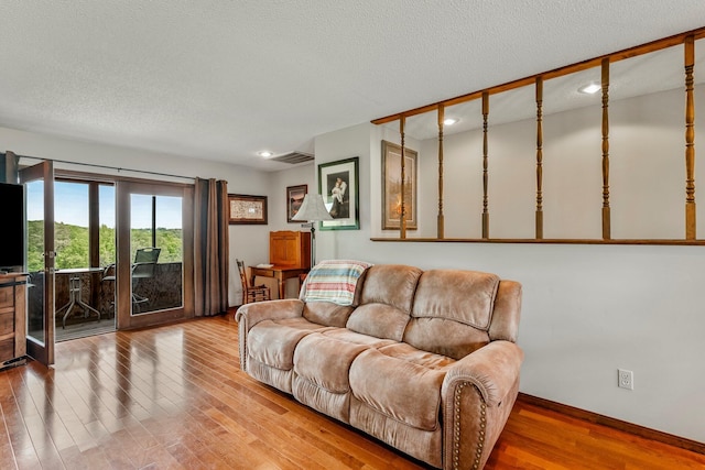 4949 S 196th Rd, Halfway, MO 65663 - living room with hardwood / wood-style flooring, recessed lighting, baseboards, and a textured ceiling