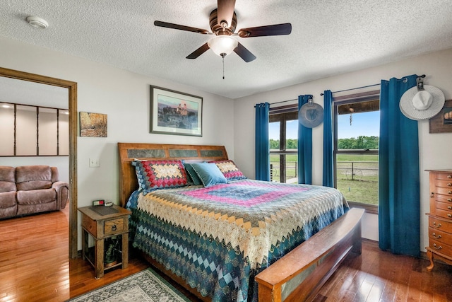 4949 S 196th Rd, Halfway, MO 65663 - bedroom with wood-type flooring, a textured ceiling, and ceiling fan