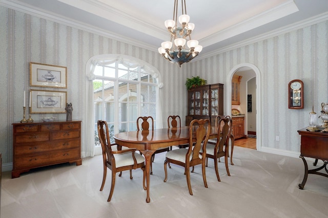 5245 S Stonehaven Dr, Springfield, MO 65809 - dining room with arched walkways, light colored carpet, wallpapered walls, crown molding, and a chandelier
