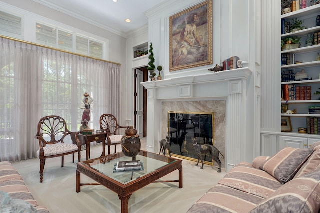 5245 S Stonehaven Dr, Springfield, MO 65809 - living area with a fireplace, light colored carpet, crown molding, built in features, and recessed lighting