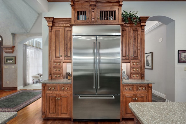 5245 S Stonehaven Dr, Springfield, MO 65809 - kitchen featuring stainless steel built in fridge, arched walkways, and baseboards