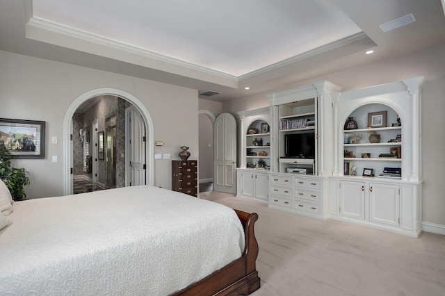5245 S Stonehaven Dr, Springfield, MO 65809 - bedroom with a raised ceiling, ornamental molding, arched walkways, recessed lighting, and light colored carpet