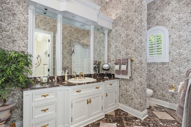 5245 S Stonehaven Dr, Springfield, MO 65809 - bathroom with toilet, vanity, wallpapered walls, baseboards, and marble finish flooring