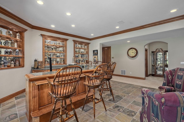 5245 S Stonehaven Dr, Springfield, MO 65809 - indoor wet bar with arched walkways, crown molding, recessed lighting, and baseboards