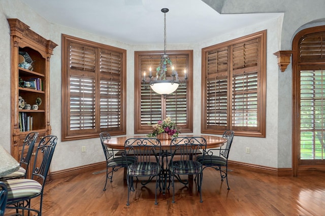 5245 S Stonehaven Dr, Springfield, MO 65809 - dining area featuring wood finished floors, baseboards, and a textured wall