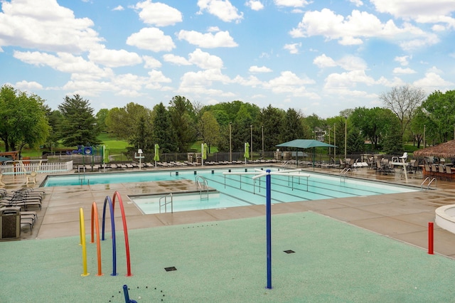 5245 S Stonehaven Dr, Springfield, MO 65809 - community pool with fence, view of scattered trees, and a patio