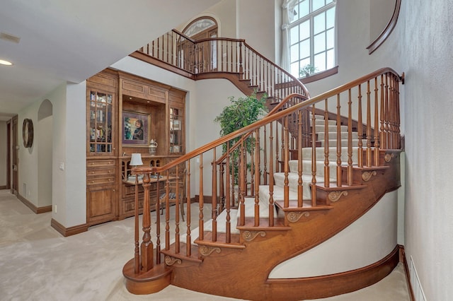 5245 S Stonehaven Dr, Springfield, MO 65809 - stairs with baseboards, a high ceiling, and carpet