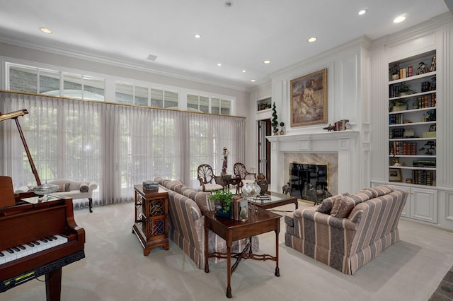 5245 S Stonehaven Dr, Springfield, MO 65809 - living area featuring ornamental molding, a premium fireplace, recessed lighting, light carpet, and built in shelves