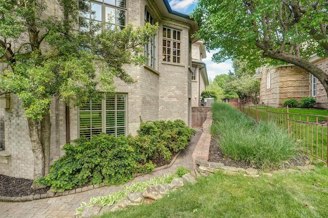 5245 S Stonehaven Dr, Springfield, MO 65809 - view of side of home featuring fence and brick siding