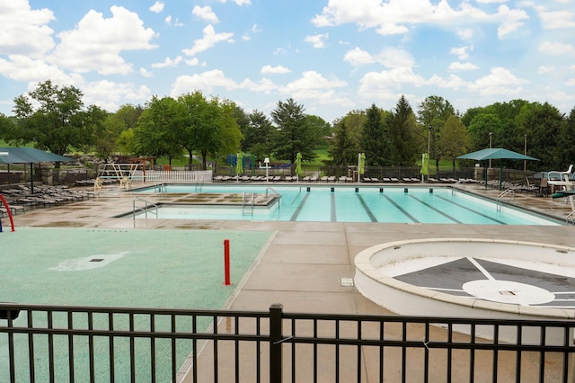 5245 S Stonehaven Dr, Springfield, MO 65809 - community pool with fence, a patio area, and view of scattered trees