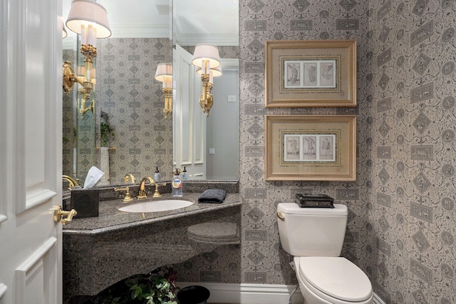 5245 S Stonehaven Dr, Springfield, MO 65809 - half bath with a sink, crown molding, toilet, and wallpapered walls