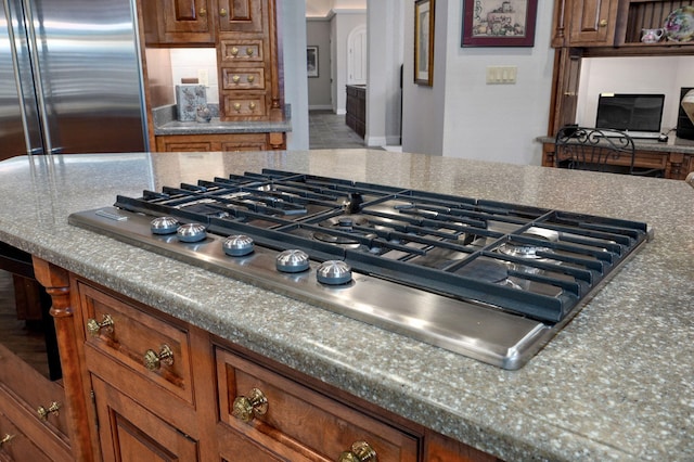5245 S Stonehaven Dr, Springfield, MO 65809 - kitchen with appliances with stainless steel finishes and brown cabinetry