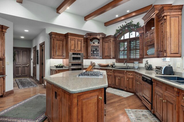 5245 S Stonehaven Dr, Springfield, MO 65809 - kitchen with appliances with stainless steel finishes, a sink, wood finished floors, decorative backsplash, and beam ceiling