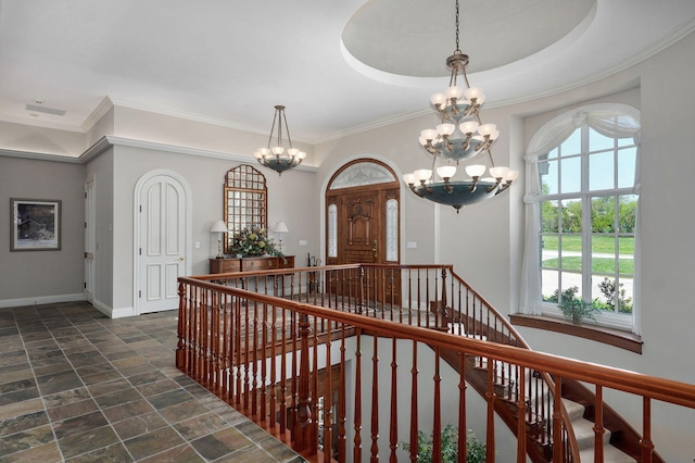 5245 S Stonehaven Dr, Springfield, MO 65809 - entryway featuring a chandelier, dark stone finish floors, baseboards, and ornamental molding